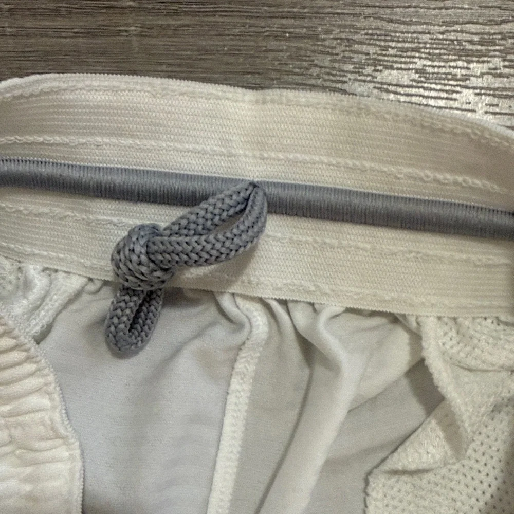 Nike Men's White Athletic Shorts with Black Swoosh